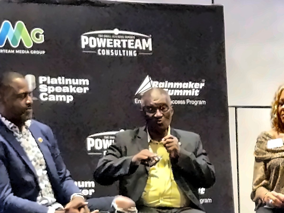 Coach Jim Foster speaking on a panel at the Powerteam Rainmaker Summit